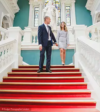 Just married couple walking down the stairs at the Woolwich Town Hall