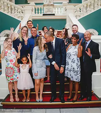 Group photo of the couple and their guests after the wedding